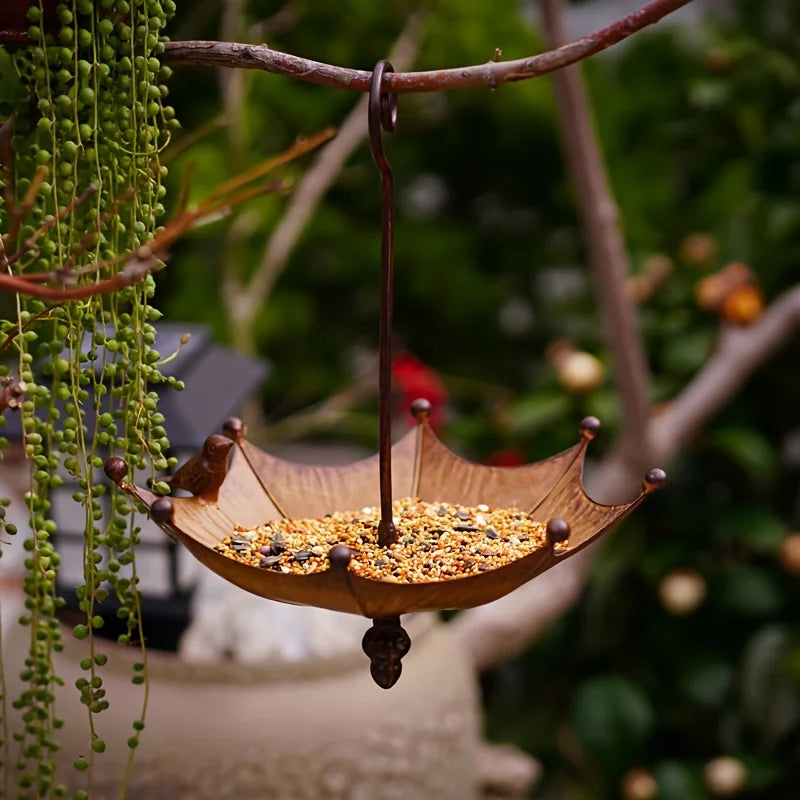 An antique umbrella shaped metal bird food tray, outdoor hanging bird bathtub and food bowl, decorative garden yard accessories